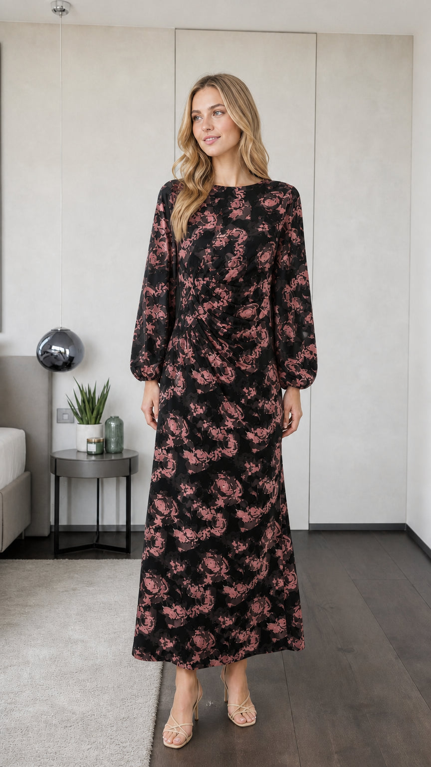 Model wearing black floral long sleeve maxi dress