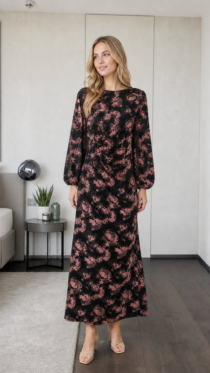 Model wearing black floral long sleeve maxi dress