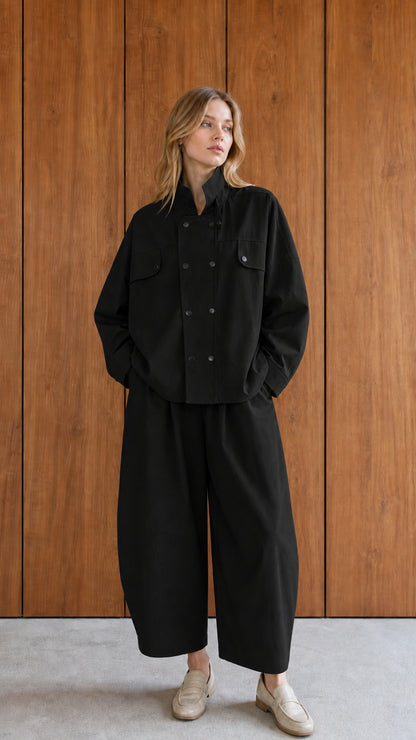Woman wearing black utility jacket and wide-leg pants set