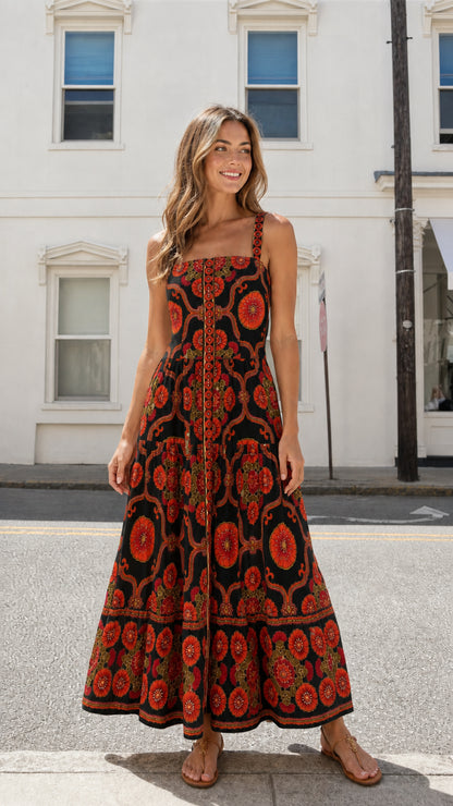 Model wearing black colorway of the floral tiered maxi dress