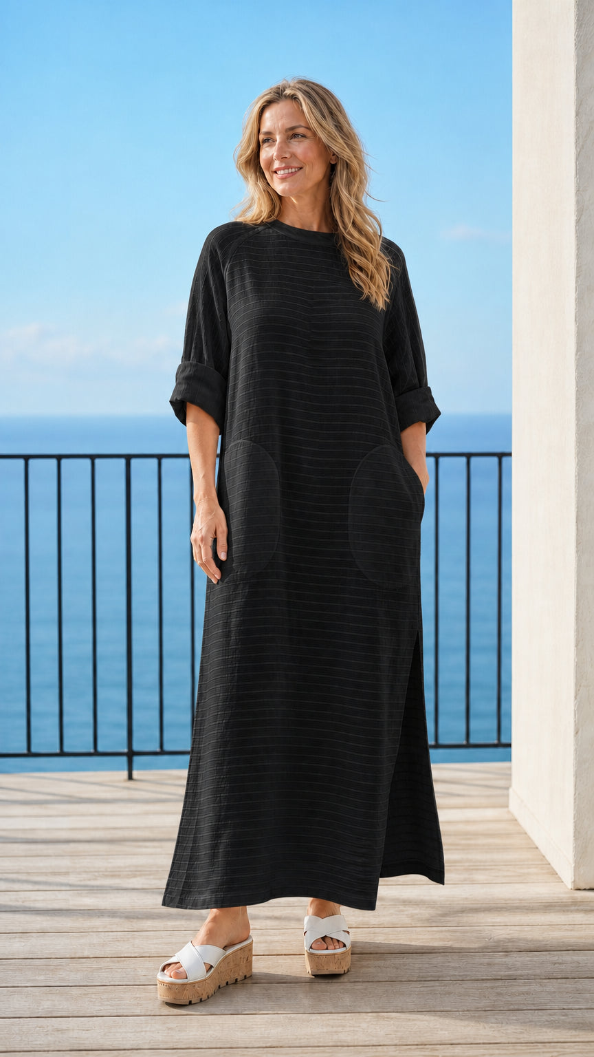 Woman wearing black long sleeve maxi dress
