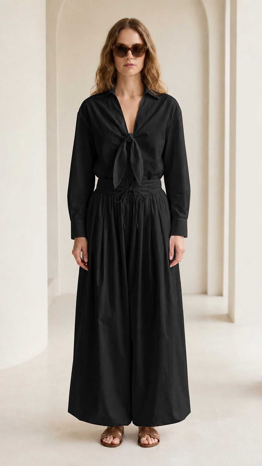 Woman wearing black tie-front shirt and wide-leg pants set