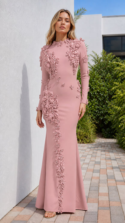 Front view of model wearing pink long sleeve evening gown