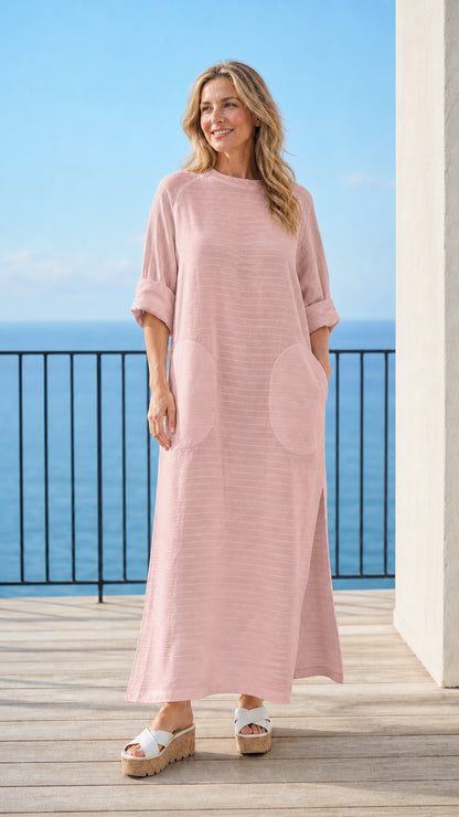 Woman wearing pink long sleeve maxi dress