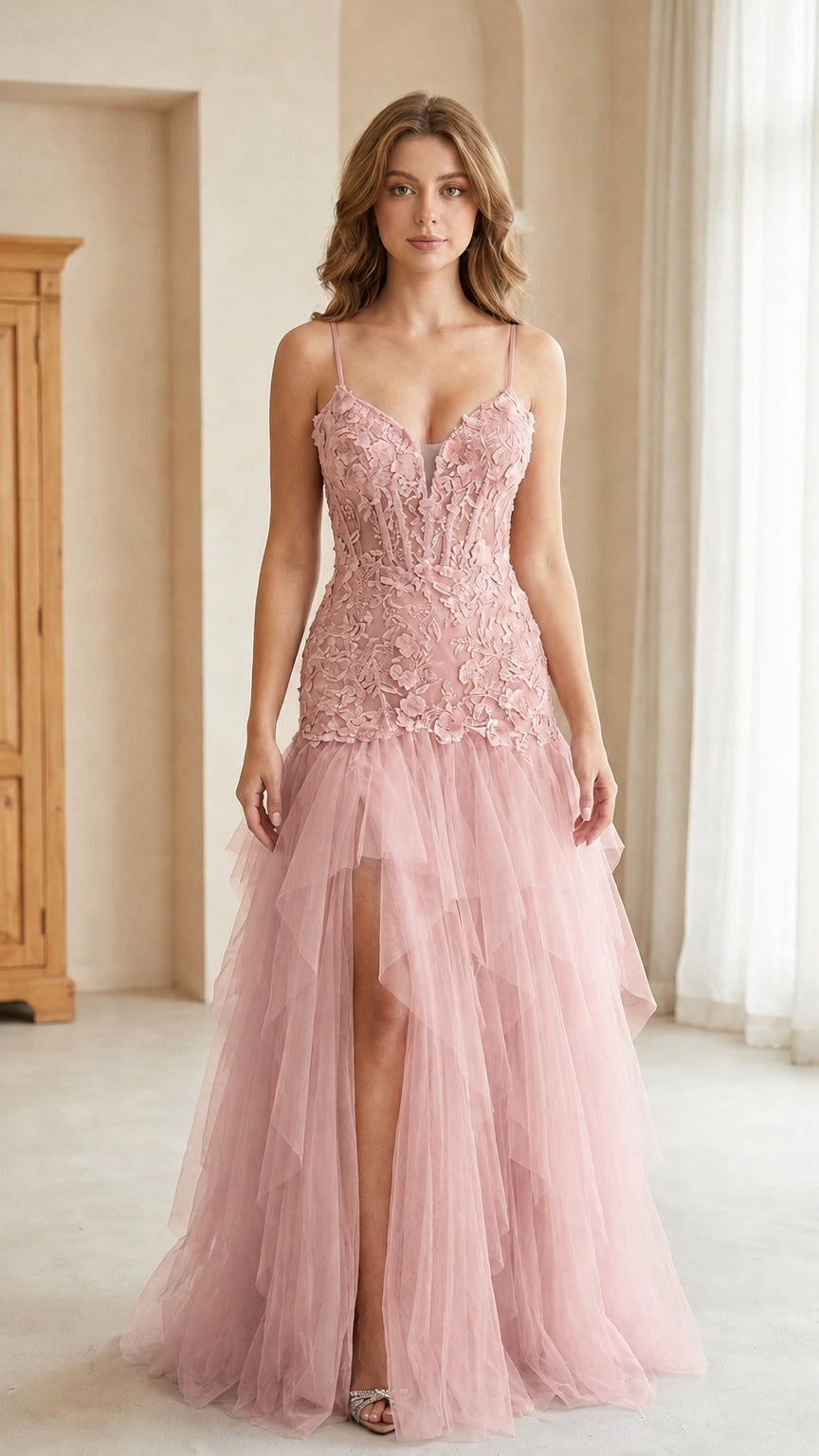 Front view of model wearing blush pink lace bodice tulle evening gown