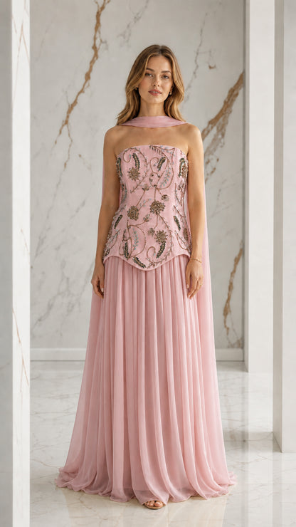 Blush pink formal strapless gown with embroidered bodice and pleated skirt