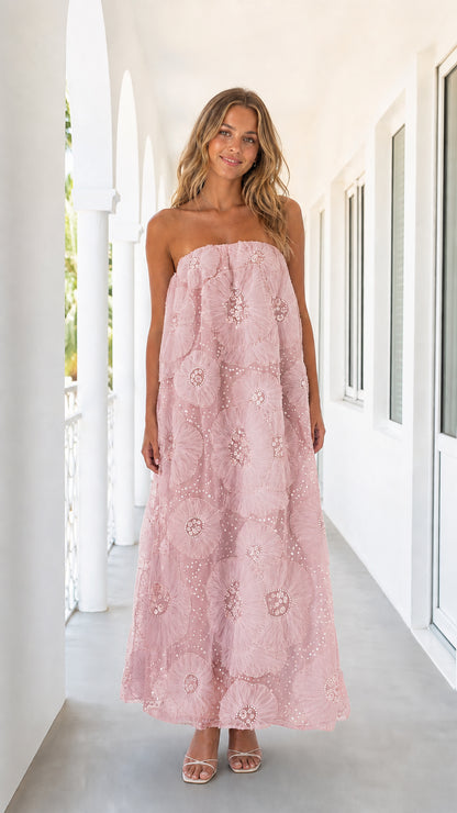 Woman wearing pink strapless floral mesh maxi dress