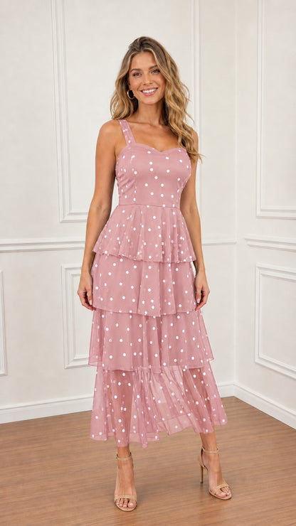 Model wearing Pink polka dot tiered midi dress