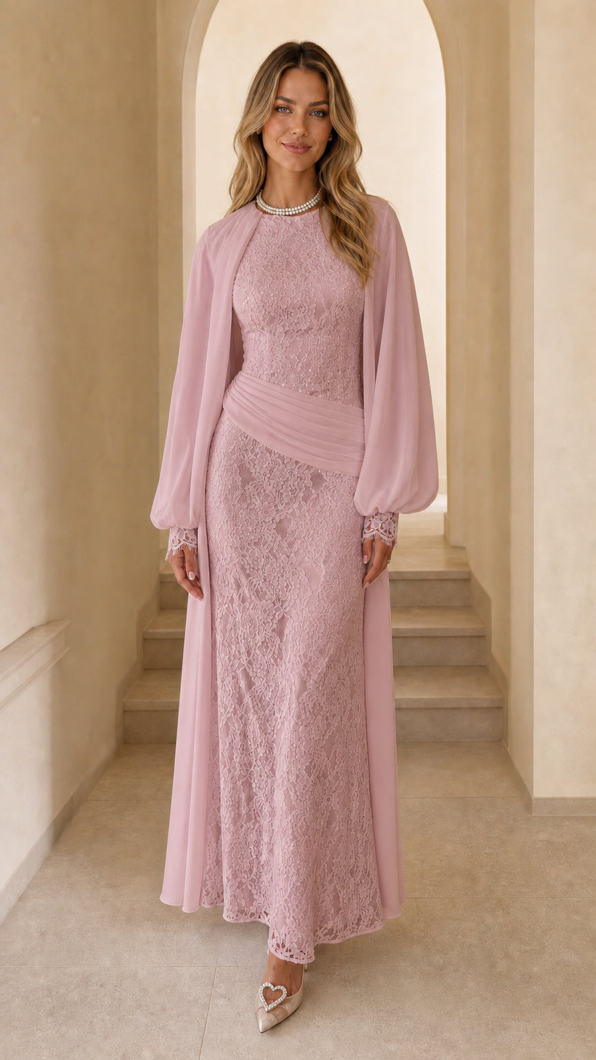 Front view of woman wearing pink long sleeve lace maxi dress