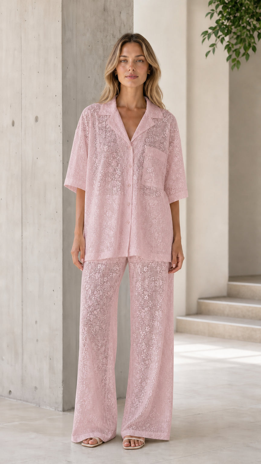 Front view of woman wearing pink lace shirt and pants set
