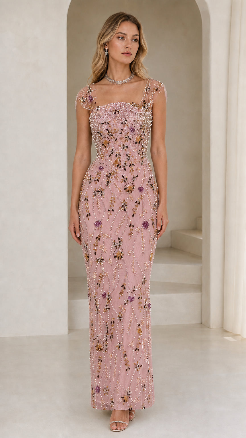 Front view of model wearing pink beaded evening gown