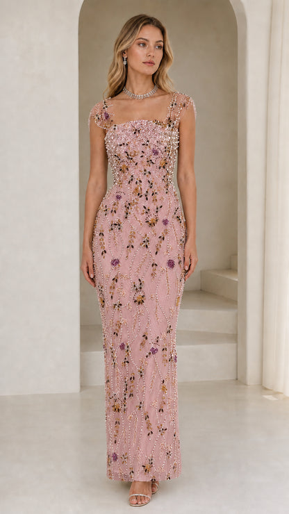 Front view of model wearing pink beaded evening gown