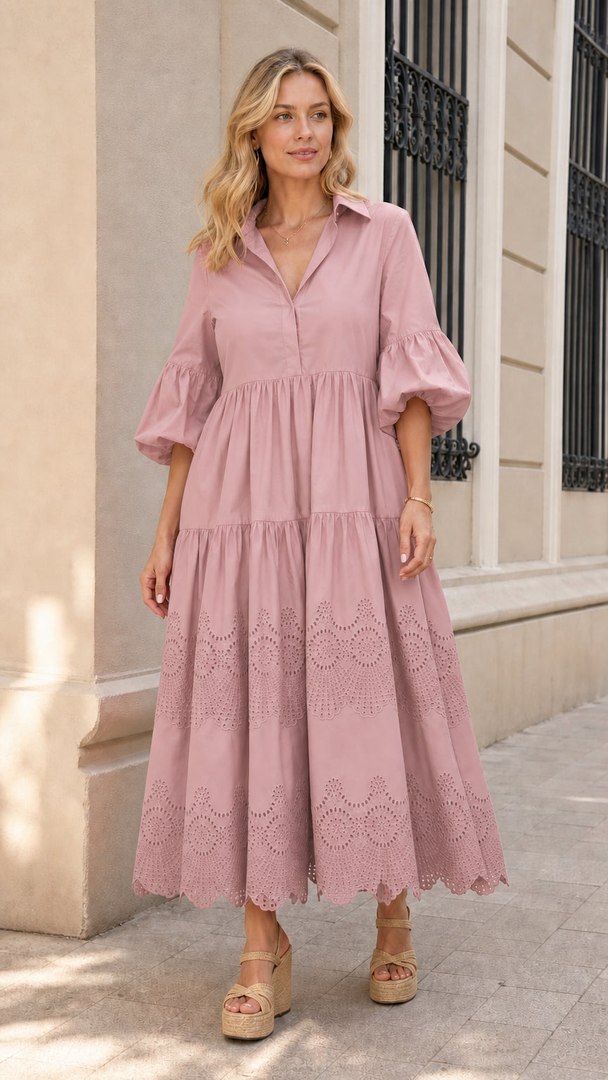 Front view of woman wearing pink collared tiered midi dress