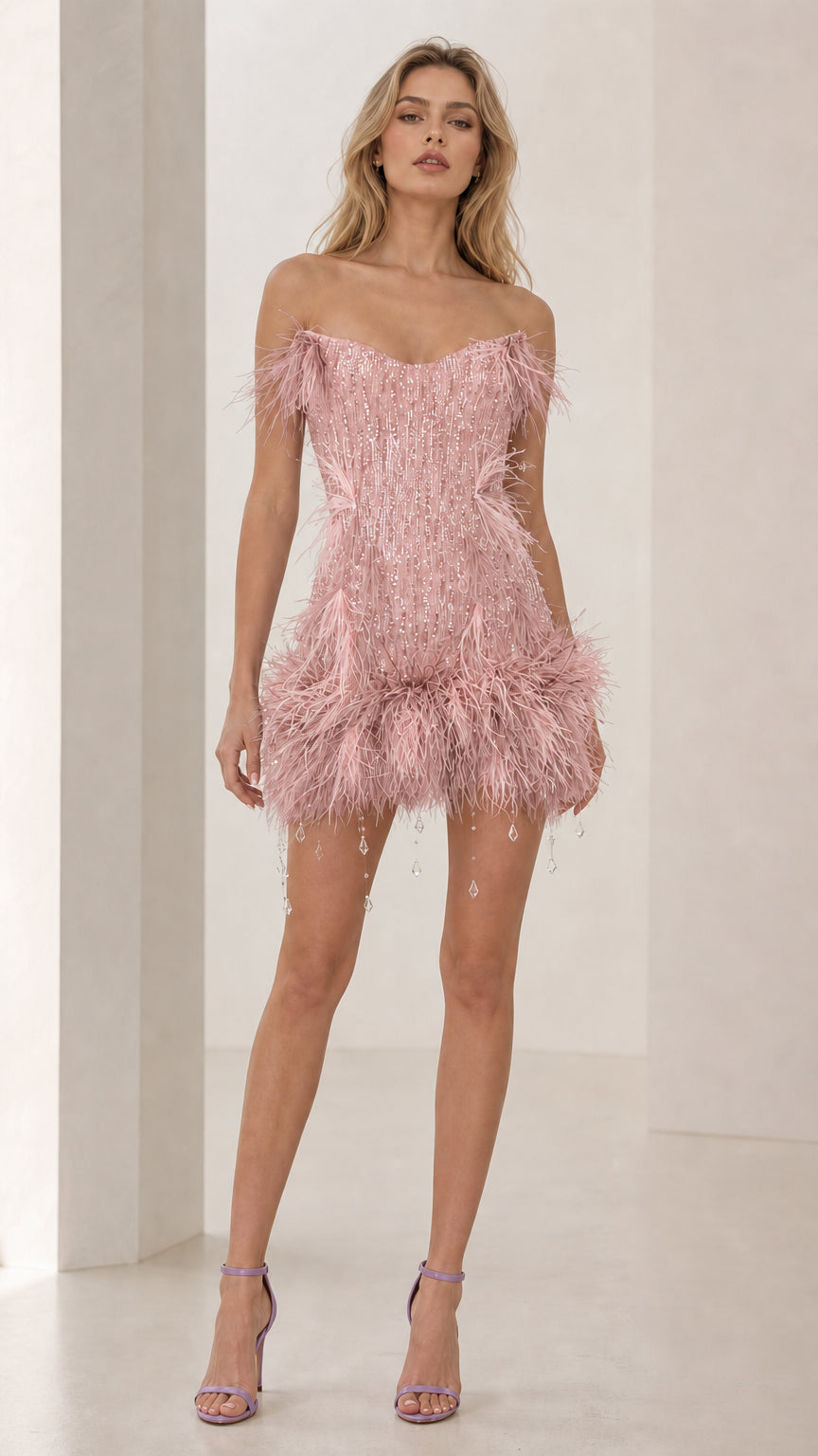 Model wearing pink feather trim sequin mini dress