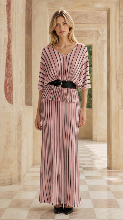 Woman wearing pink striped two-piece maxi dress set