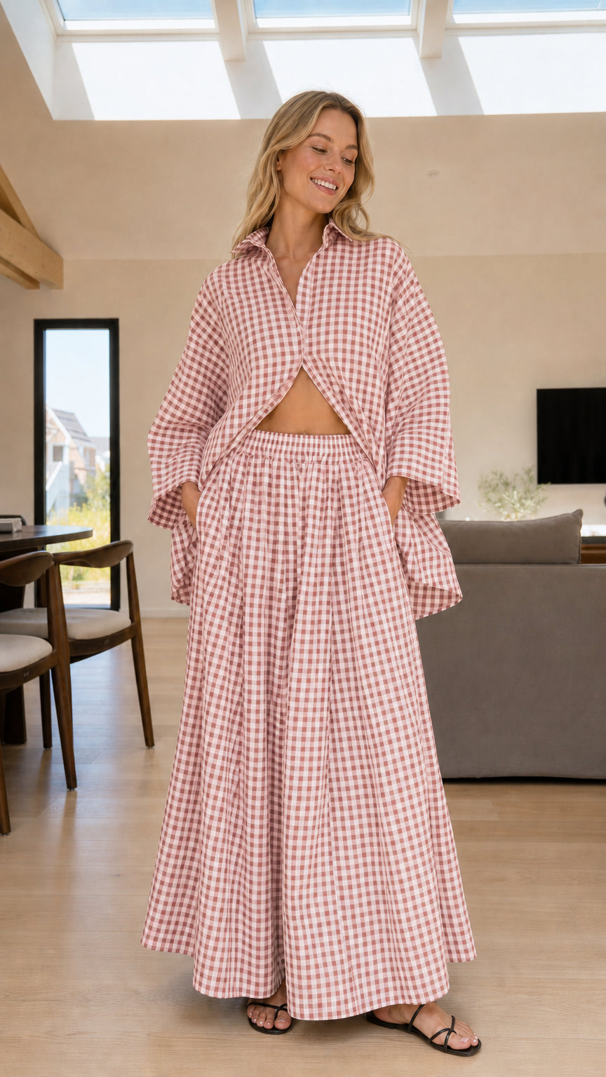 Woman wearing pink and white gingham check shirt and wide-leg pants set