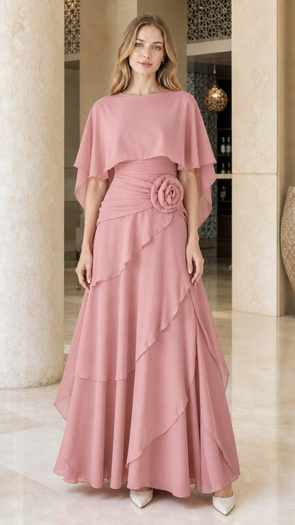 Front view of woman wearing dusty pink chiffon cape formal evening dress