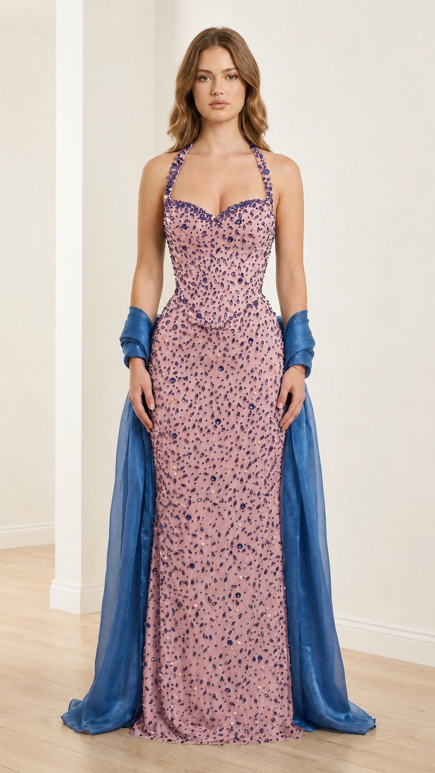 Front view of pink embellished halter evening gown