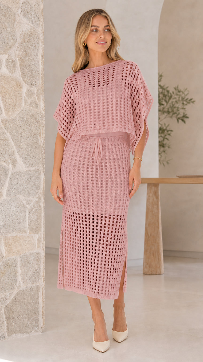 Model wearing pink open-knit two piece skirt set