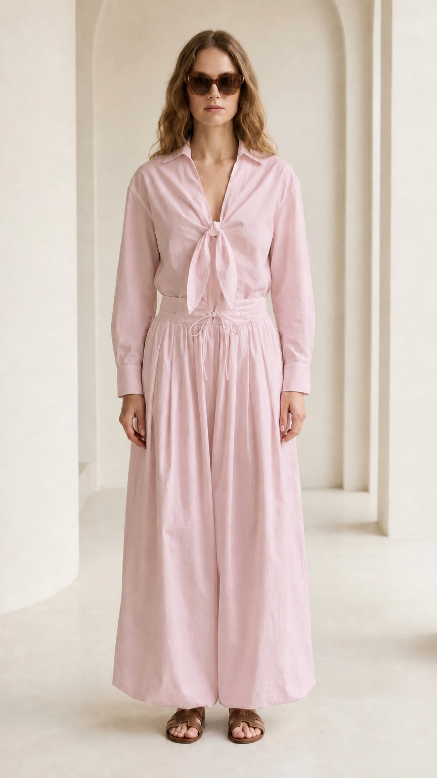 Woman wearing pink tie-front shirt and wide-leg pants set