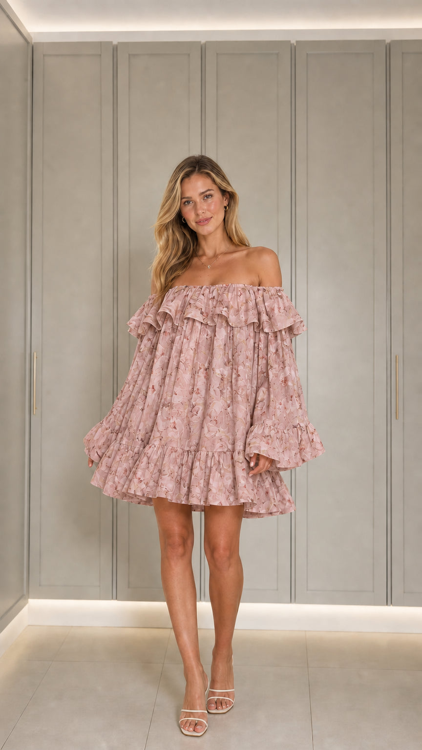 Front view of model wearing pink floral mini dress