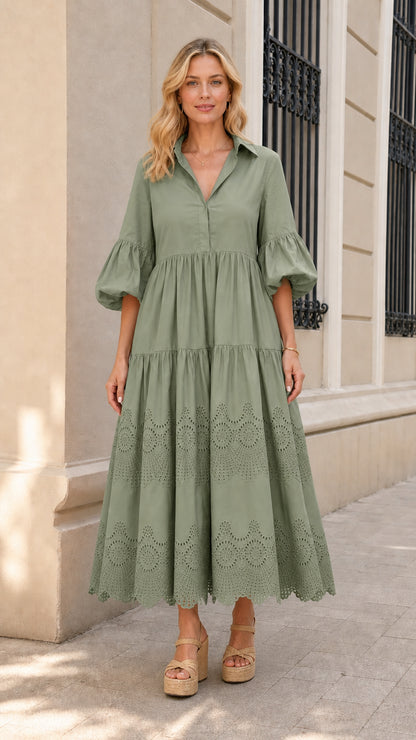 Front view of woman wearing sage green collared tiered midi dress