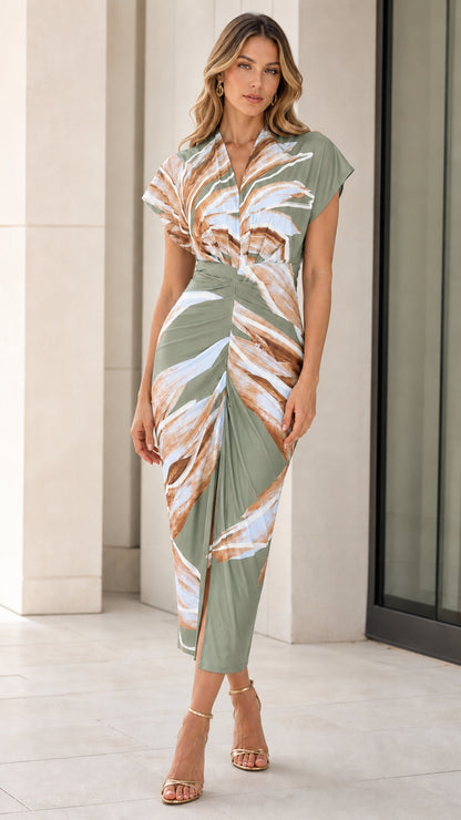 Woman wearing green abstract print midi dress