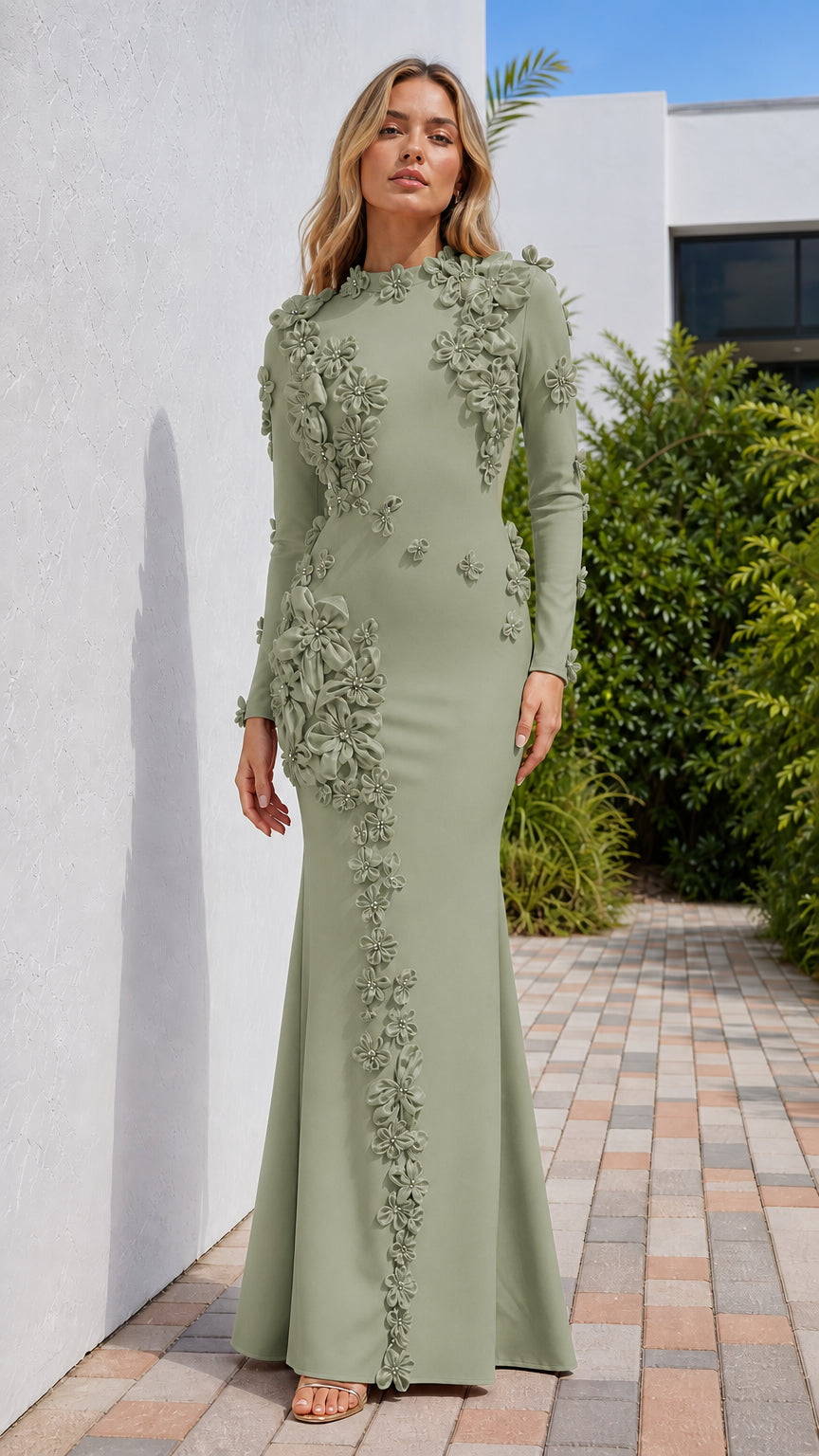 Front view of model wearing sage green long sleeve evening gown