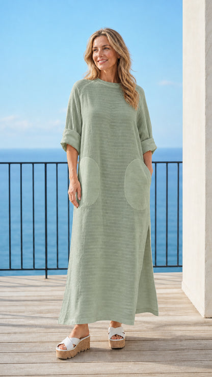 Woman wearing green long sleeve maxi dress