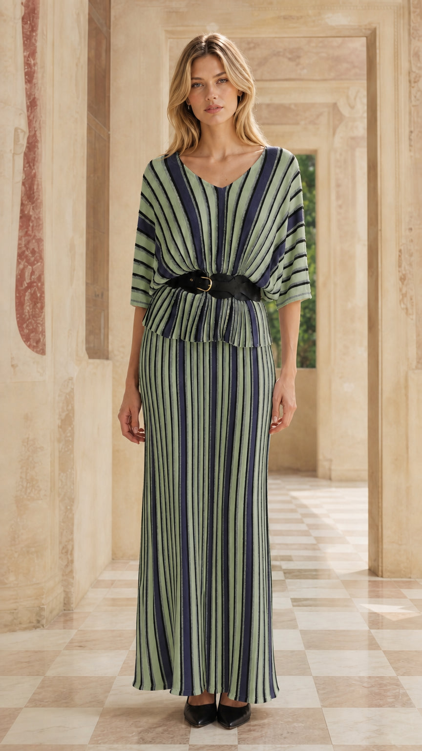 Woman wearing green striped two-piece maxi dress set