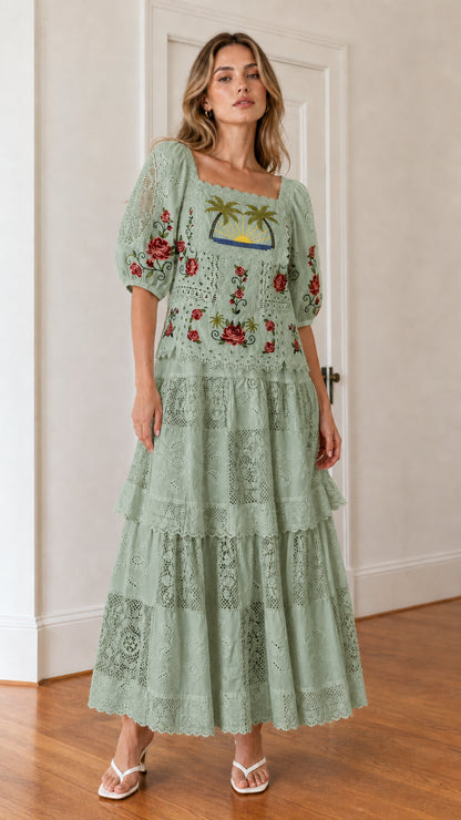 Front view of woman wearing sage green embroidered maxi dress