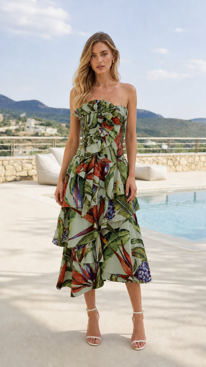 Front view of model wearing sage tropical print strapless midi dress