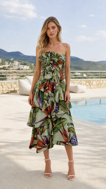 Front view of model wearing sage tropical print strapless midi dress