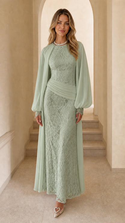 Front view of woman wearing sage green long sleeve lace maxi dress