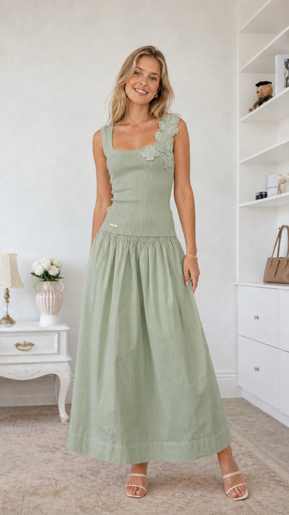 Model wearing sage green color variant of the floral applique midi dress