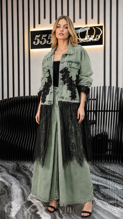 Front view of model wearing green denim long jacket and matching pants with lace trim