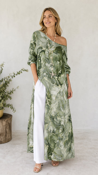 Model wearing green marble print off-shoulder maxi tunic with white pants