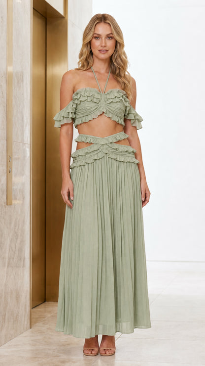 Front view of model wearing sage color variant