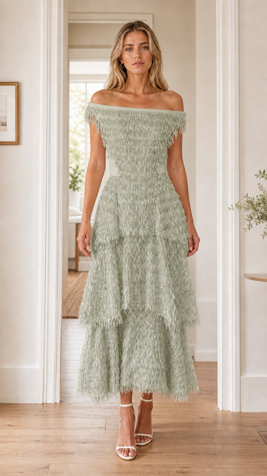 Front view of woman in sage green off-the-shoulder fringe dress