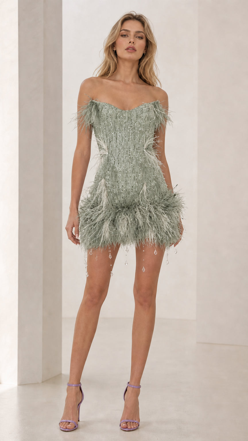 Model wearing sage green feather trim sequin mini dress