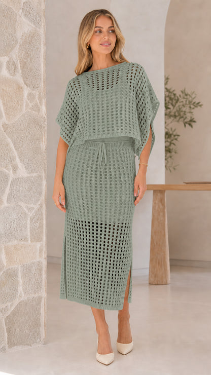 Model wearing sage green open-knit two piece skirt set