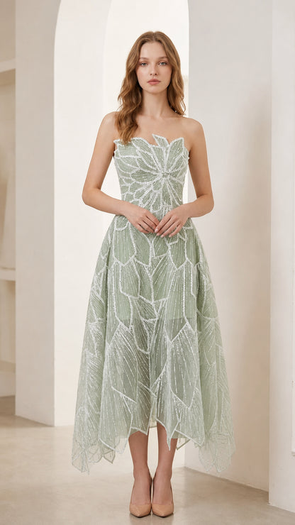 Woman wearing sage green strapless beaded leaf embroidery midi cocktail dress