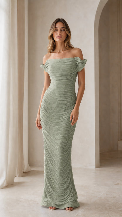 Model wearing sage green formal gown