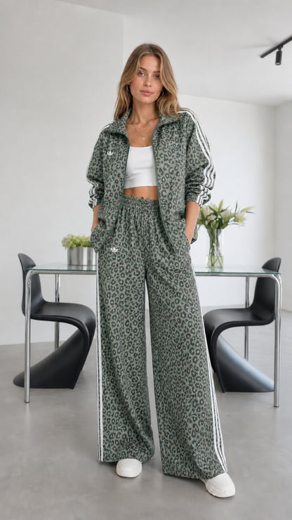 Model wearing green leopard print track set