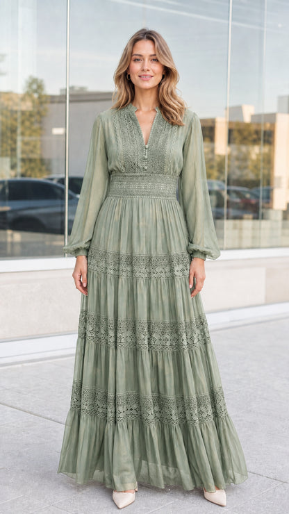 Front view of woman wearing sage green lace trim tiered maxi dress