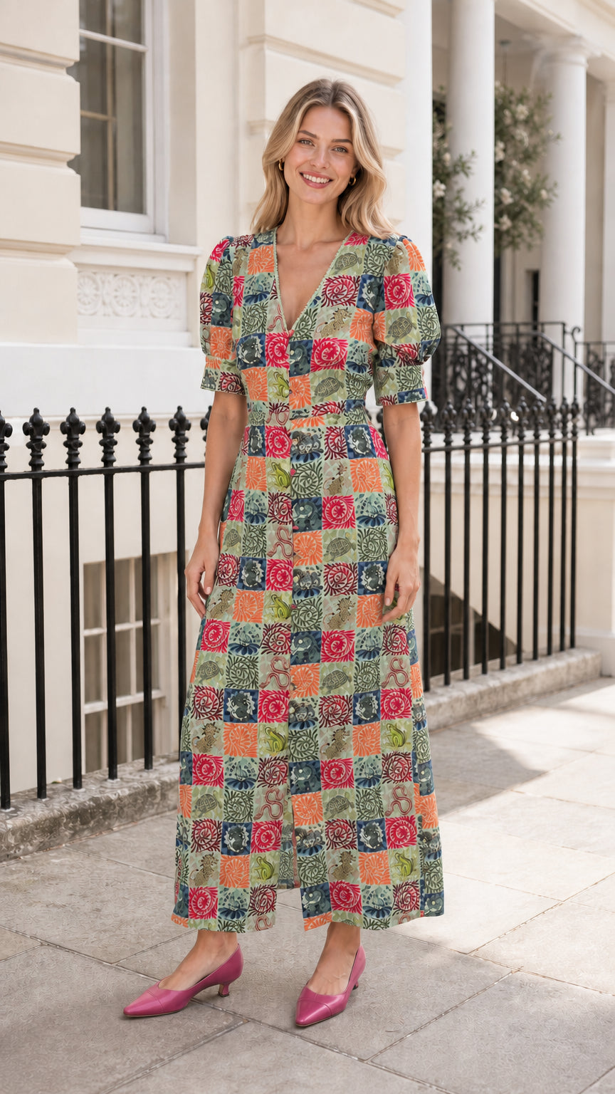 Woman wearing green-based patchwork midi dress outdoors