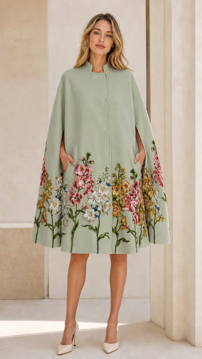 Front view of Sage Green floral embroidered cape coat on model