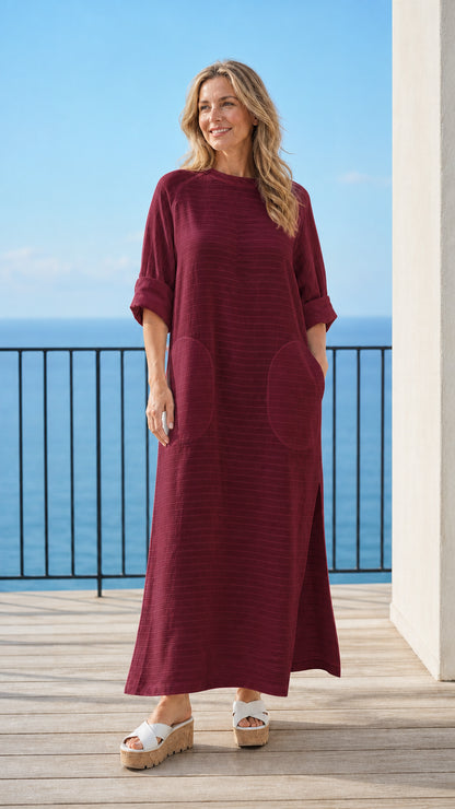Woman wearing burgundy long sleeve maxi dress