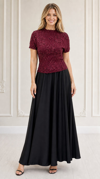 Model wearing burgundy textured floral bodice maxi dress