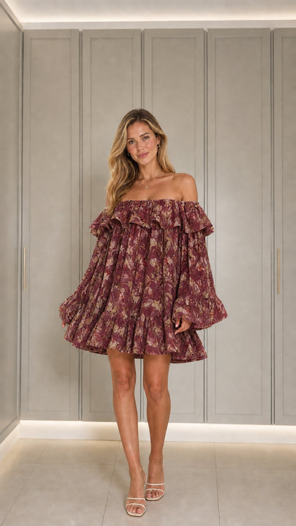 Front view of model wearing burgundy floral mini dress